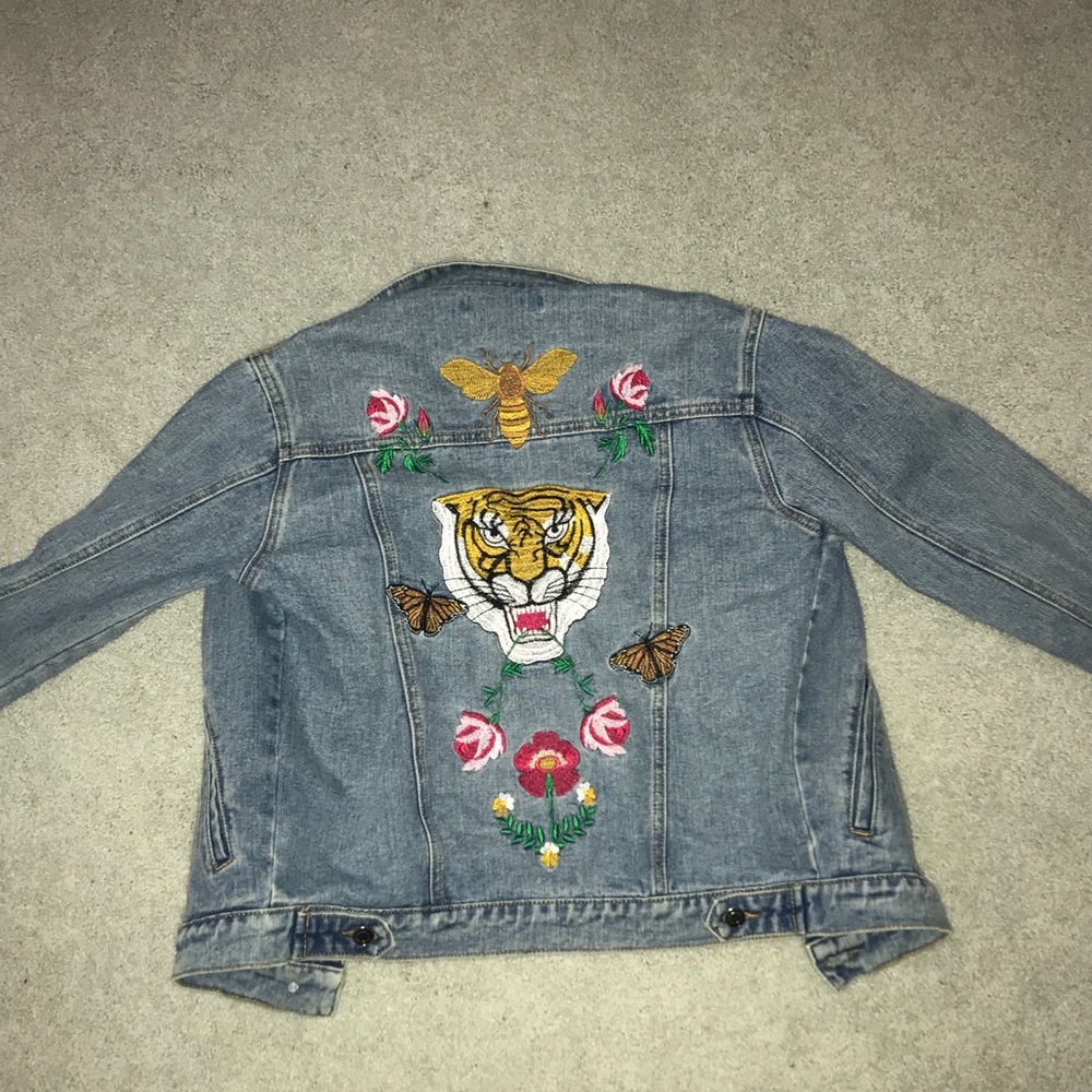 Jean jacket with patches across the front & back!